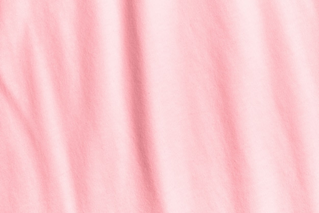 Textura e fundo de tecido rosa pastel amassado