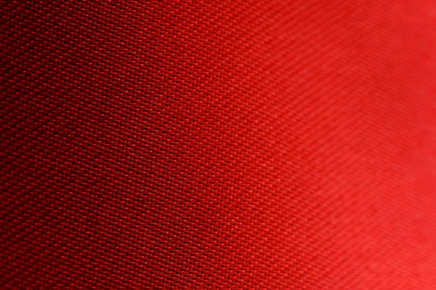 Foto textura e fundo de tecido vermelho em close-up em fotos macro