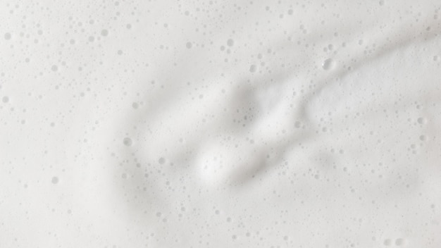 Foto textura de espuma jabonosa blanca de fondo abstracto espuma de champú con burbujas