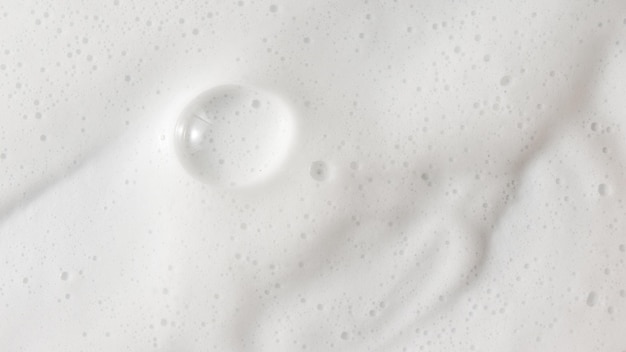 Foto textura de espuma jabonosa blanca de fondo abstracto espuma de champú con burbujas