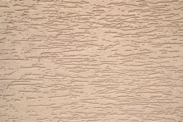 Textura de estuco gris marrón o beige primer plano superficie texturizada grunge sucia oscura