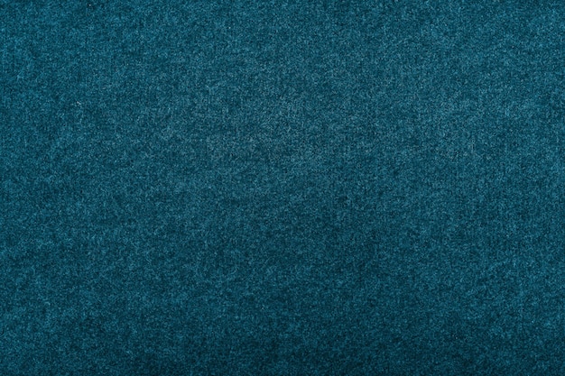 Foto textura de fieltro o lana para fondo azul.