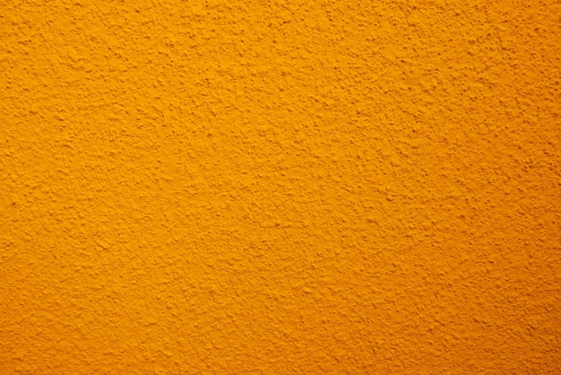 Textura fluida de la antigua muralla de cemento amarillo una superficie áspera con espacio para texto para un fondox9