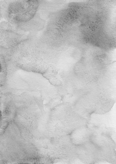 Textura de fondo de acuarela gris tranquila abstracta, pintada a mano. Fondo gris artístico, manchas en papel. Papel pintado de pintura Aquarelle en blanco y negro.