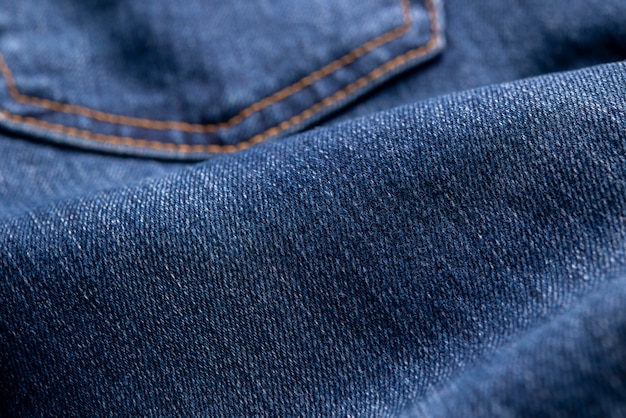Textura del fondo azul de la tela del dril de algodón.