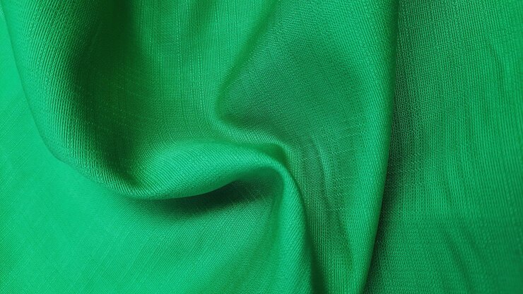 Foto textura de fondo de detalle de tela verde esmeralda