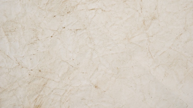 Textura de fondo de grunge de papel beige áspero para el diseño