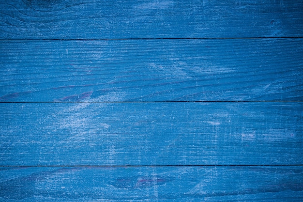 Foto textura de fondo de madera azul vintage con nudos y agujeros para clavos. antiguo muro de madera pintada.