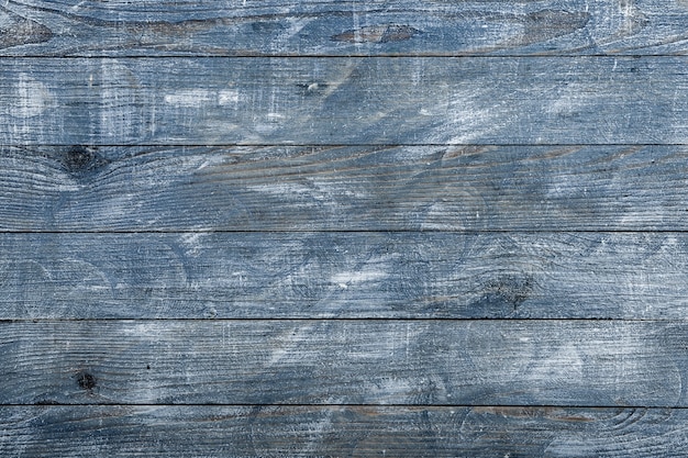 Textura de fondo de madera azul vintage con nudos y agujeros para clavos