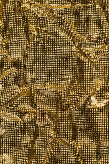 La textura de fondo de oro brillante material de aluminio metálico aislamiento de espacio moderno lujo caro.