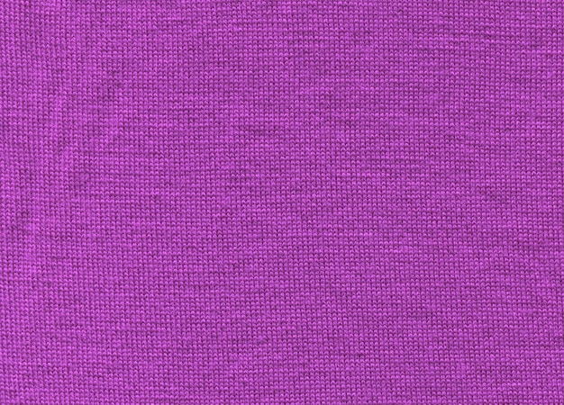 Textura de un fondo de pantalla de suéter violeta de punto