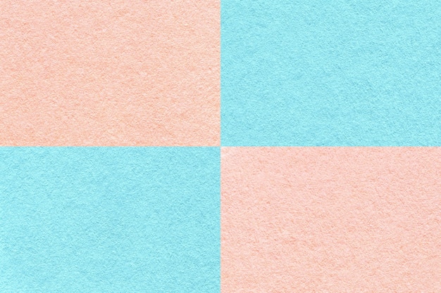 Textura de fondo de papel azul claro y rosa artesanal con patrón de celdas macro Cartón rosa kraft denso vintage