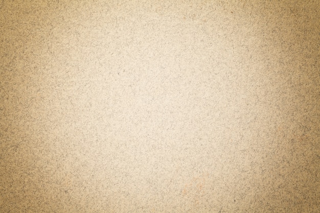 Textura del fondo del papel marrón claro de la vendimia con la ilustración mate. Estructura de cartón kraft beige con marco.