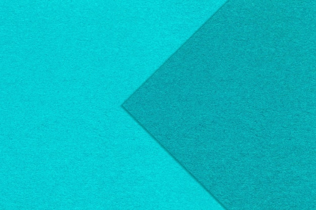 Textura de fondo de papel turquesa y cerúleo medio dos colores con flecha Estructura de cartón azul artesanal