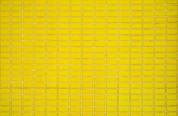 Foto textura de fondo de pared de azulejo clásico amarillo viejo