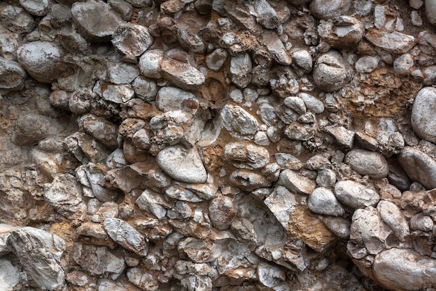 Textura de fondo de piedras en roca que se desmorona. Imagen horizontal.