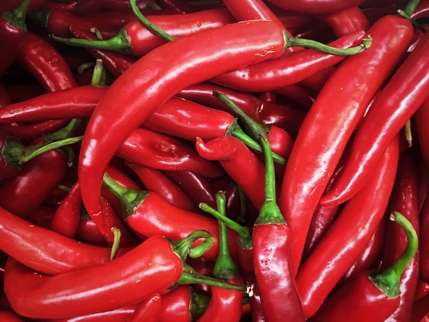 Textura de fondo de pimientos rojos de condimento de chile picante ardiente un plato para el mercado de venta