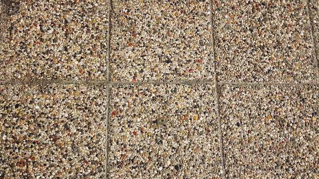 Textura de fondo del piso de piedra de guijarros Patrón del piso de piedra de pavimentación