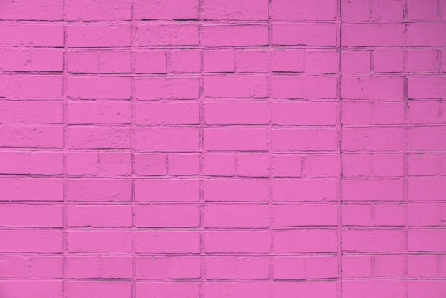 Textura y fondo plano de marco completo de pared de ladrillo pintado de color rosa mate