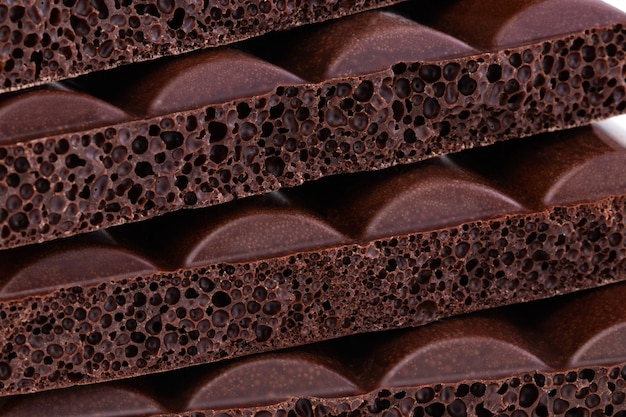 Textura de fondo de primer plano de chocolate poroso con leche.