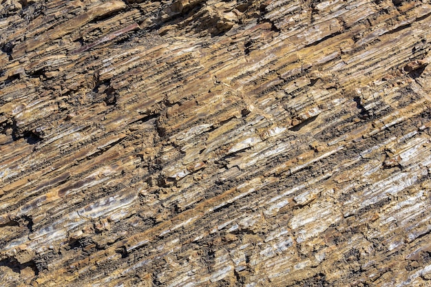 Textura de fondo de roca marrón en capas