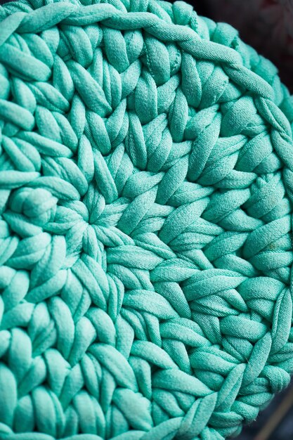 Textura Ganchillo turquesa en un círculo de tejido de hilo de punto Cerrar