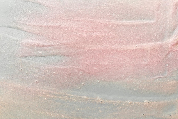 Textura de gel de belleza con partículas rosadas y doradas Fondo de resaltado brillante con pinceladas