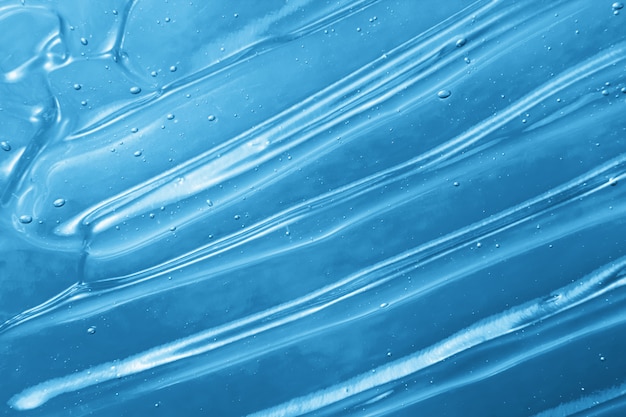 Textura de gel cosmético azul con burbujas