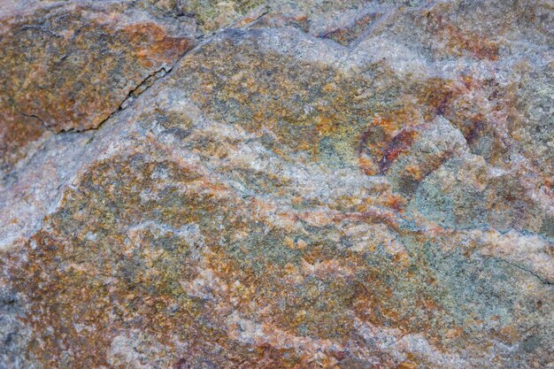 Textura de granito de cerca Rocas de granito con superficie porosa Fondo de piedra sólida