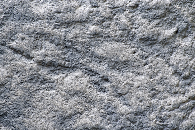 Textura de gris degradado con fondo de piedra blanca. De cerca