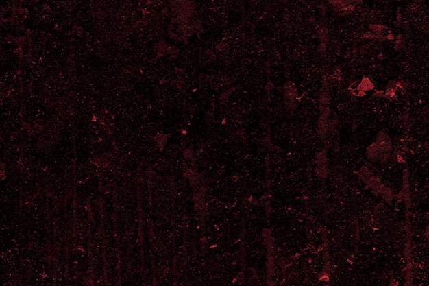 Textura grunge de hormigón oscuro de color rojo angustiado para el fondo