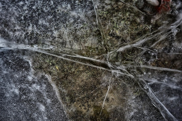 Textura de hielo agrietado, fondo abstracto frío de invierno estacional, hielo natural, hielo roto en un lago