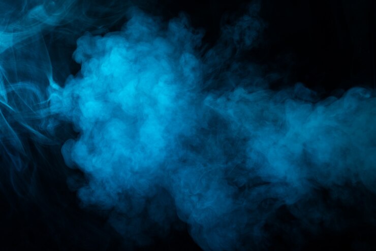 Foto textura de humo azul sobre fondo negro