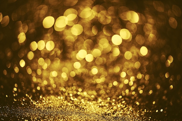 Textura de iluminación de bokeh de brillo dorado Fondo abstracto borroso para cumpleaños aniversario boda fin de año o Navidad