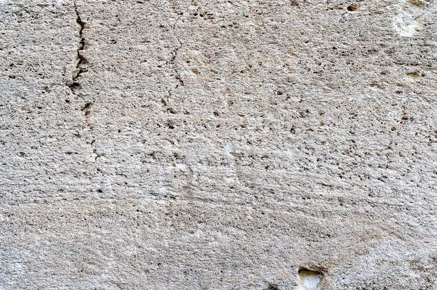 Textura de imagen cercana de la superficie de la roca de la cáscara blanca y gris