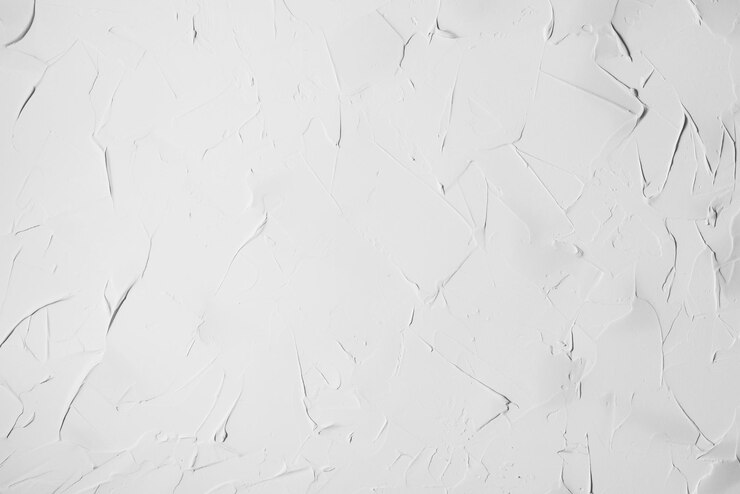 Foto textura irregular de gesso branco aplicada com uma espátula em uma parede