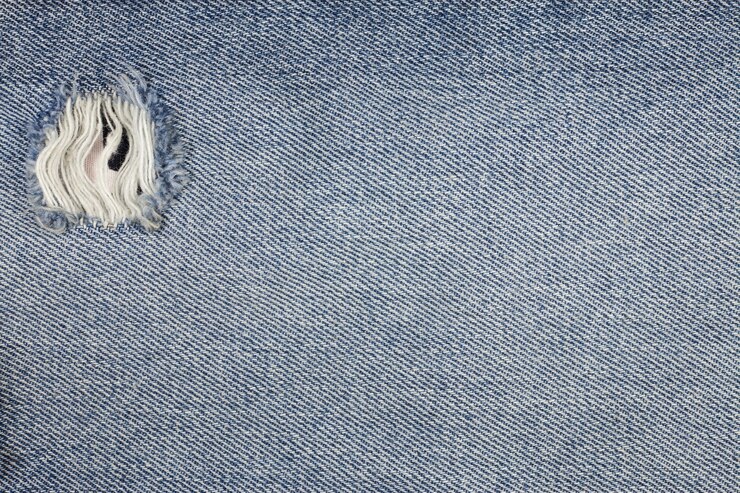 Textura de jeans de mezclilla rasgada azul