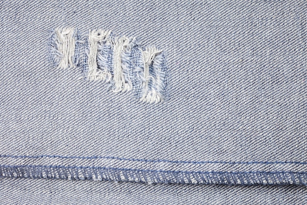 Textura de jeans de mezclilla rasgada azul