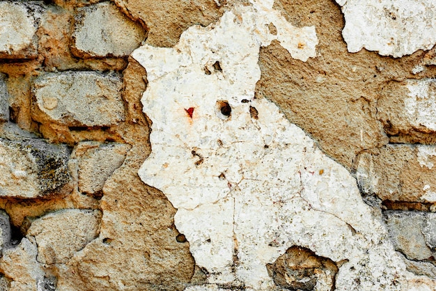 Textura de ladrillo con arañazos y grietas.