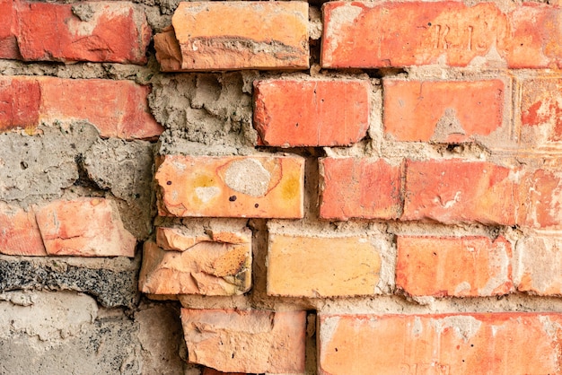 Foto textura de ladrillo con arañazos y grietas