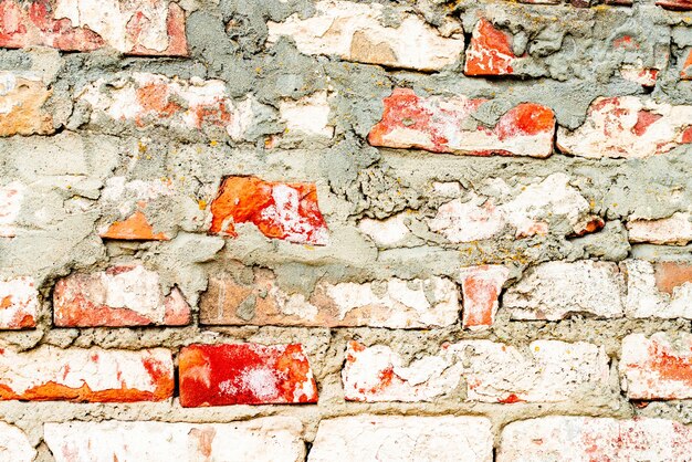 Textura, ladrillo, pared, se puede utilizar como fondo. Textura de ladrillo con arañazos y grietas.