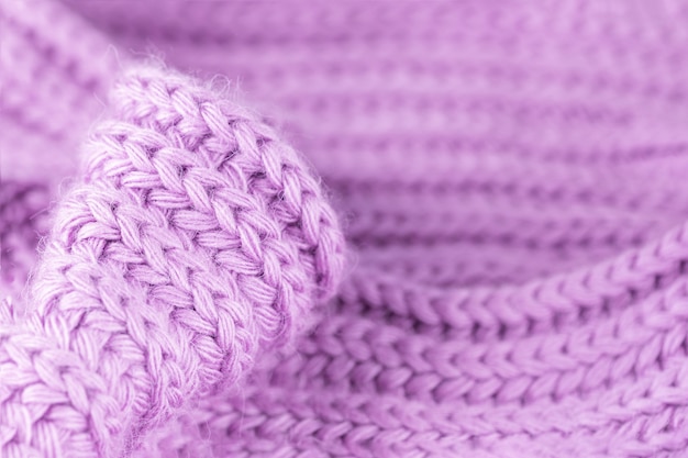 Textura de lana de punto rosa púrpura violeta suave pálido cálido y acogedor