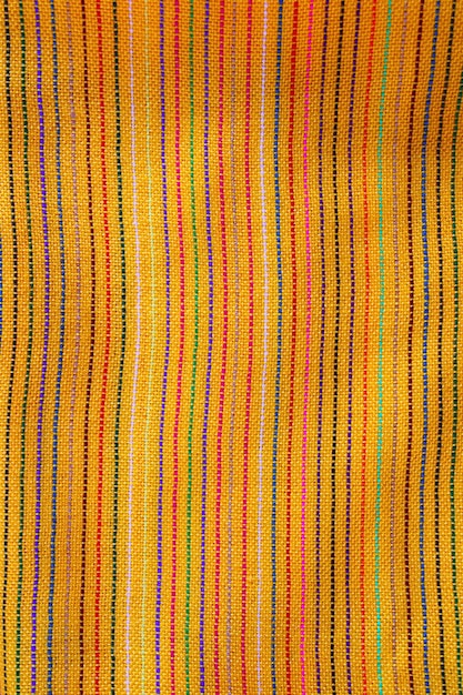 Foto textura macra amarilla vibrante de la tela del sarape mexicano