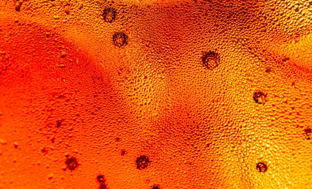 Textura macro cola, cola con fondo de comida helada, primer plano de cola, elemento de diseño. macroburbujas de cerveza,