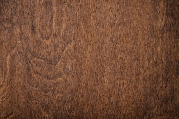 Textura de madera oscura para el diseño de muebles mesa o tablero marrón como fondo