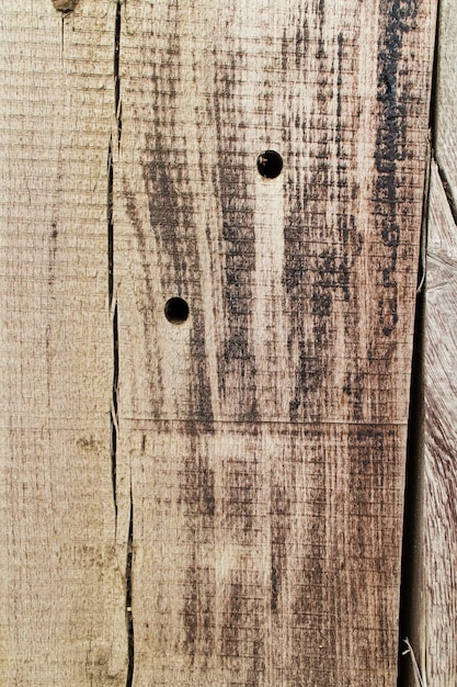 Textura de madera vieja con agujeros y grietas