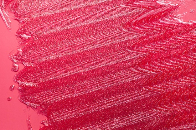 Textura manchada de lápiz labial rosa brillante