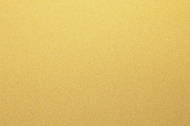 Textura de material de aluminio cepillado dorado Útil para el fondo en trabajos de diseño