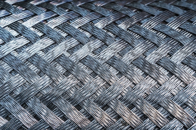 Textura metálica de tejido de espiga de acero. Pantalla completa, primer plano