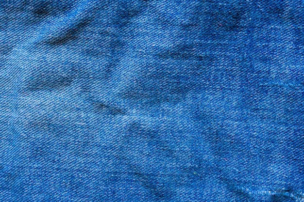 Textura de mezclilla azul jeans cerrar vista superior de fondo